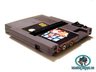 Illustration for article titled NES Cartridge Modded into NES System. Space-Time Remains Intact